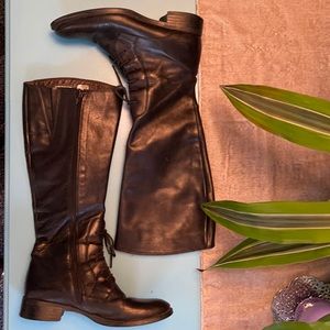 Tall black leather boots.